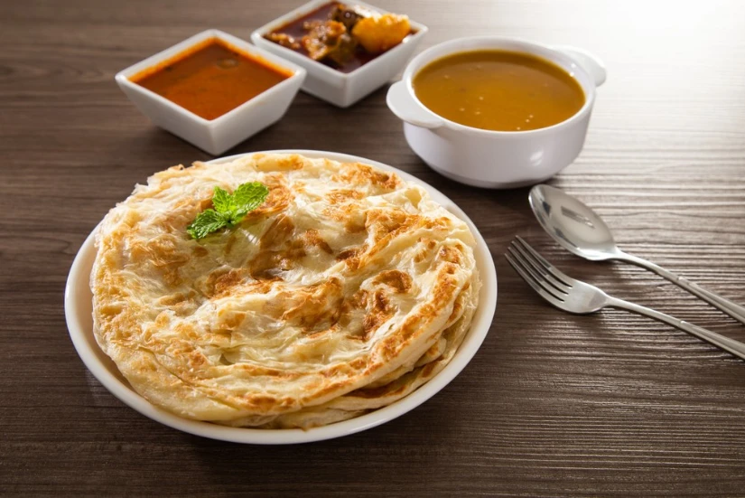 Roti canai with dipping sauces served at a restaurant in Chinatown Las Vegas