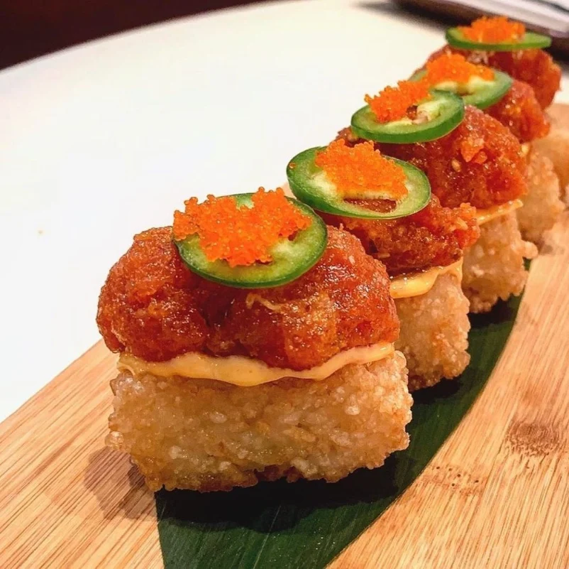 Crispy rice topped with spicy tuna, jalapeƱo slices, and roe at a restaurant on the Las Vegas Strip