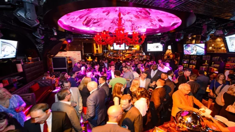 Nightclub scene at Drais in Las Vegas, featuring a lively crowd, vibrant lighting, and luxurious decor
